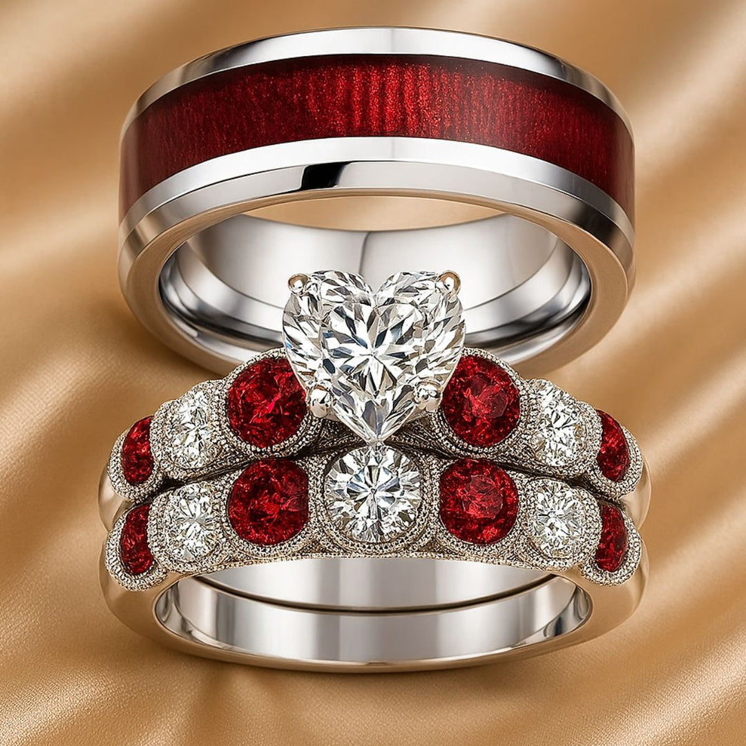 Red Love ring set by CouplesChoices.com, featuring a heart-shaped diamond atop vintage pavé bands with ruby red and white stones, paired with a polished redwood inlay band for timeless romance.