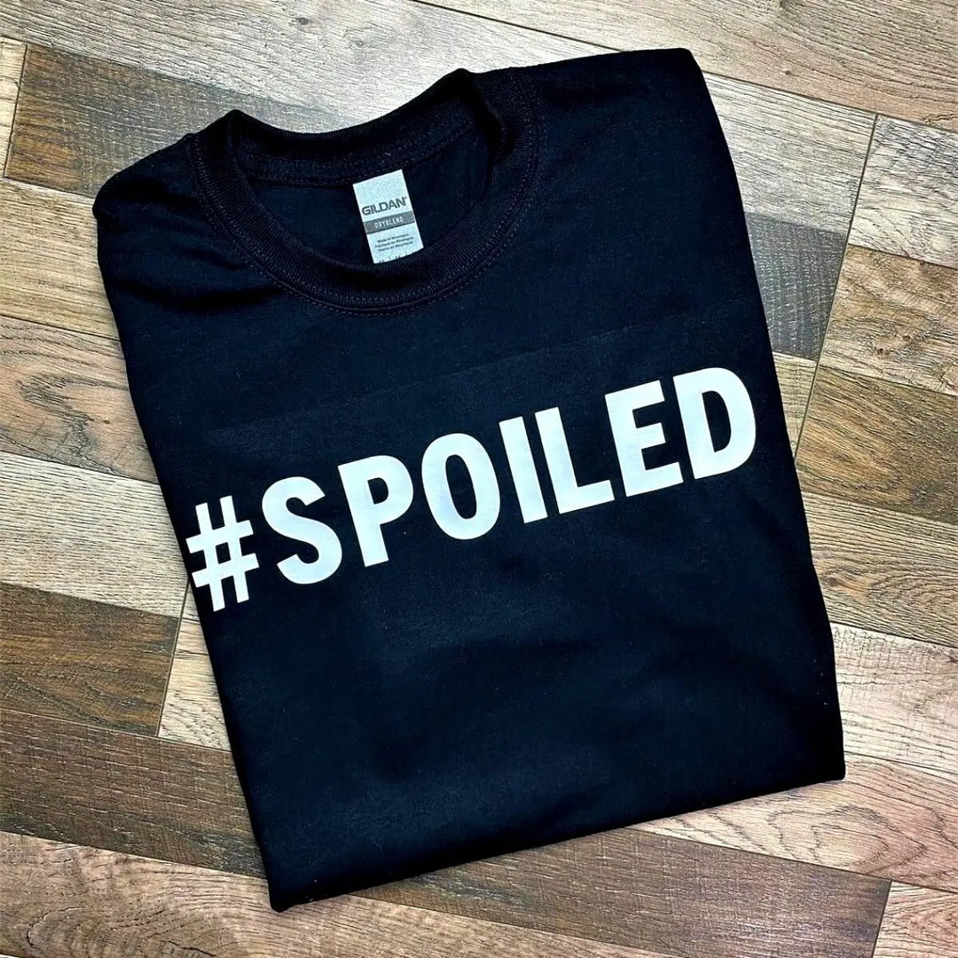 Couples' black matching tees—his says '#Broke', hers reads '#Spoiled' in bold white text. A hilarious and relatable duo for couples who know love isn’t always 50/50. From CouplesChoices.com.