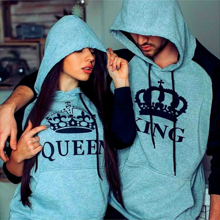 Matching heather gray and black couple hoodies from CouplesChoices.com featuring bold black “KING” and “QUEEN” lettering with royal crown graphics. A sleek and modern set designed for couples who wear their love with confidence and class.