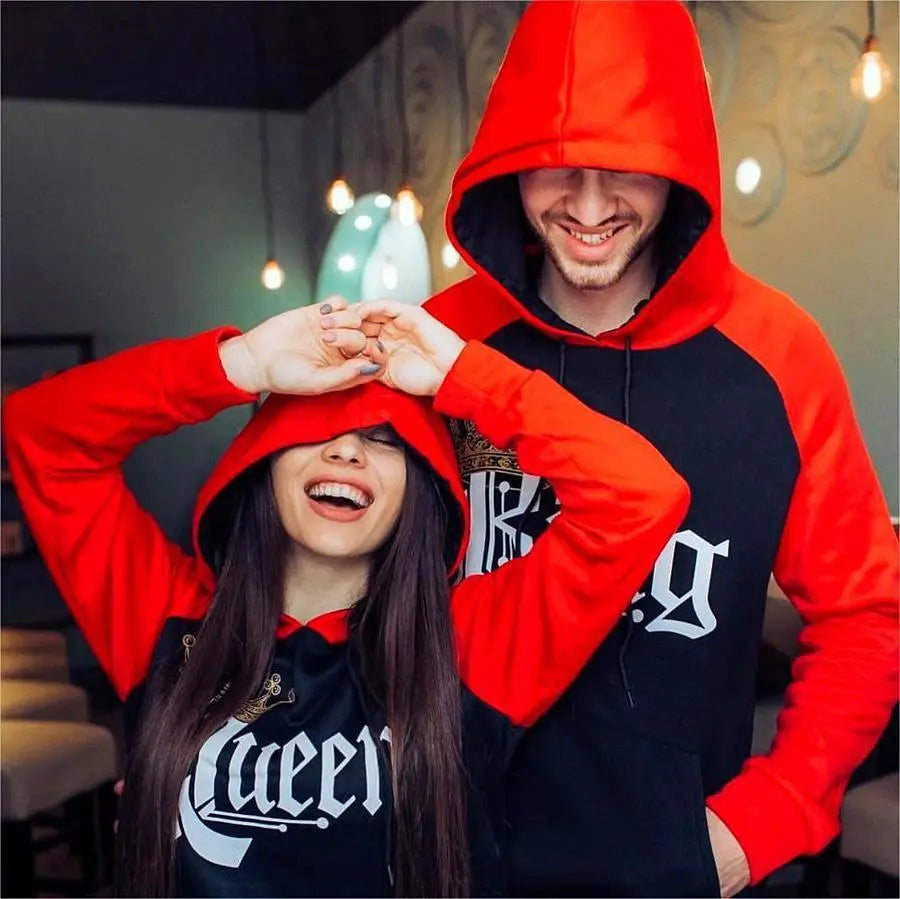 Matching red and black couple hoodies from CouplesChoices.com featuring bold gothic “King” and “Queen” lettering with gold crown graphics. A regal and romantic streetwear set designed for couples who rule in love and confidence.