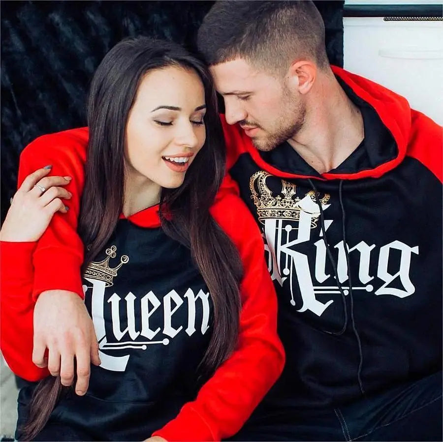 Matching red and black couple hoodies from CouplesChoices.com featuring bold gothic “King” and “Queen” lettering with gold crown graphics. A regal and romantic streetwear set designed for couples who rule in love and confidence.
