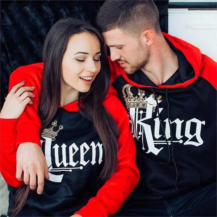 Matching red and black couple hoodies from CouplesChoices.com featuring bold gothic “King” and “Queen” lettering with gold crown graphics. A regal and romantic streetwear set designed for couples who rule in love and confidence.
