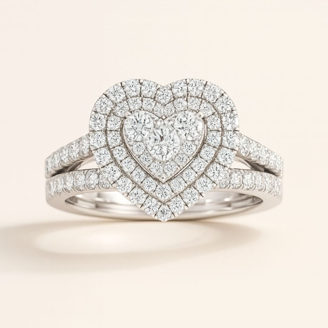 CouplesChoices.com Infinity Rings – A dazzling bridal set with a heart-shaped diamond cluster and pavé halos, paired with a men’s polished band inlaid with channel-set diamonds. A timeless expression of infinite love and luxury.