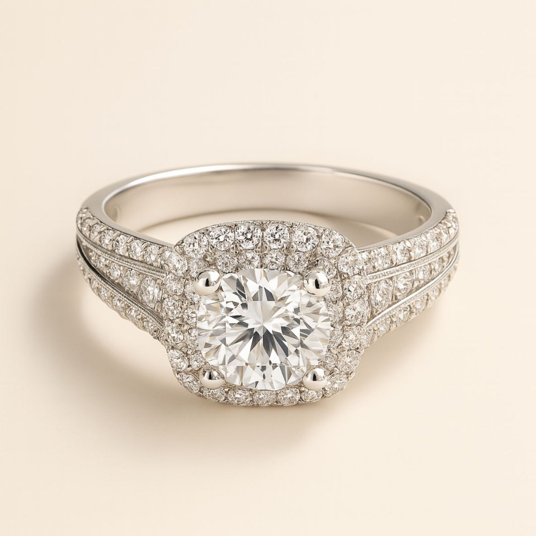 Aurora Rings by CouplesChoices.com – a breathtaking titanium wedding set featuring a cushion-cut center stone, double halo pavé design, and a sleek men’s band with channel-set brilliance for a timeless, luxurious finish.