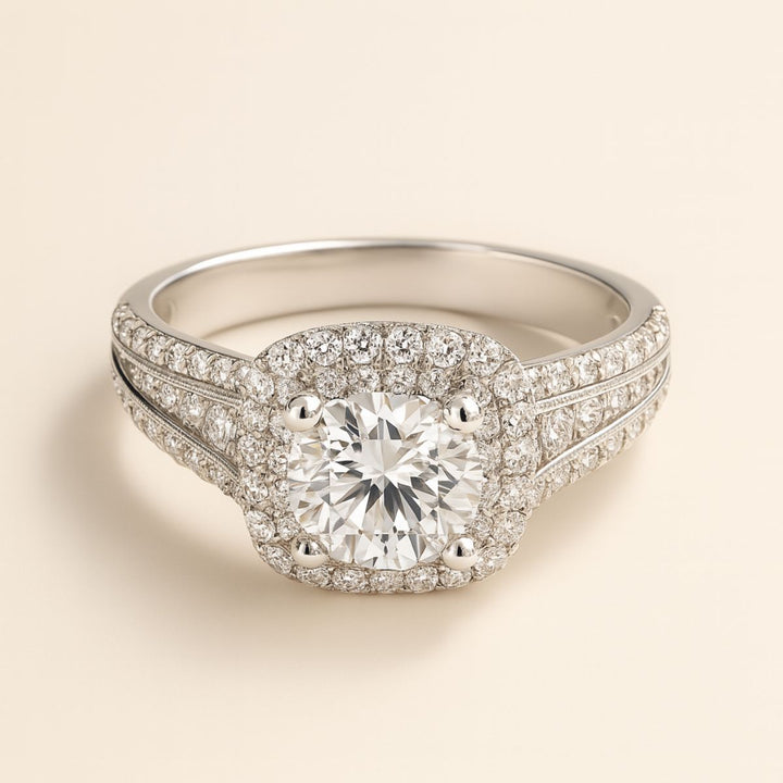 Aurora Rings by CouplesChoices.com – a breathtaking titanium wedding set featuring a cushion-cut center stone, double halo pavé design, and a sleek men’s band with channel-set brilliance for a timeless, luxurious finish.