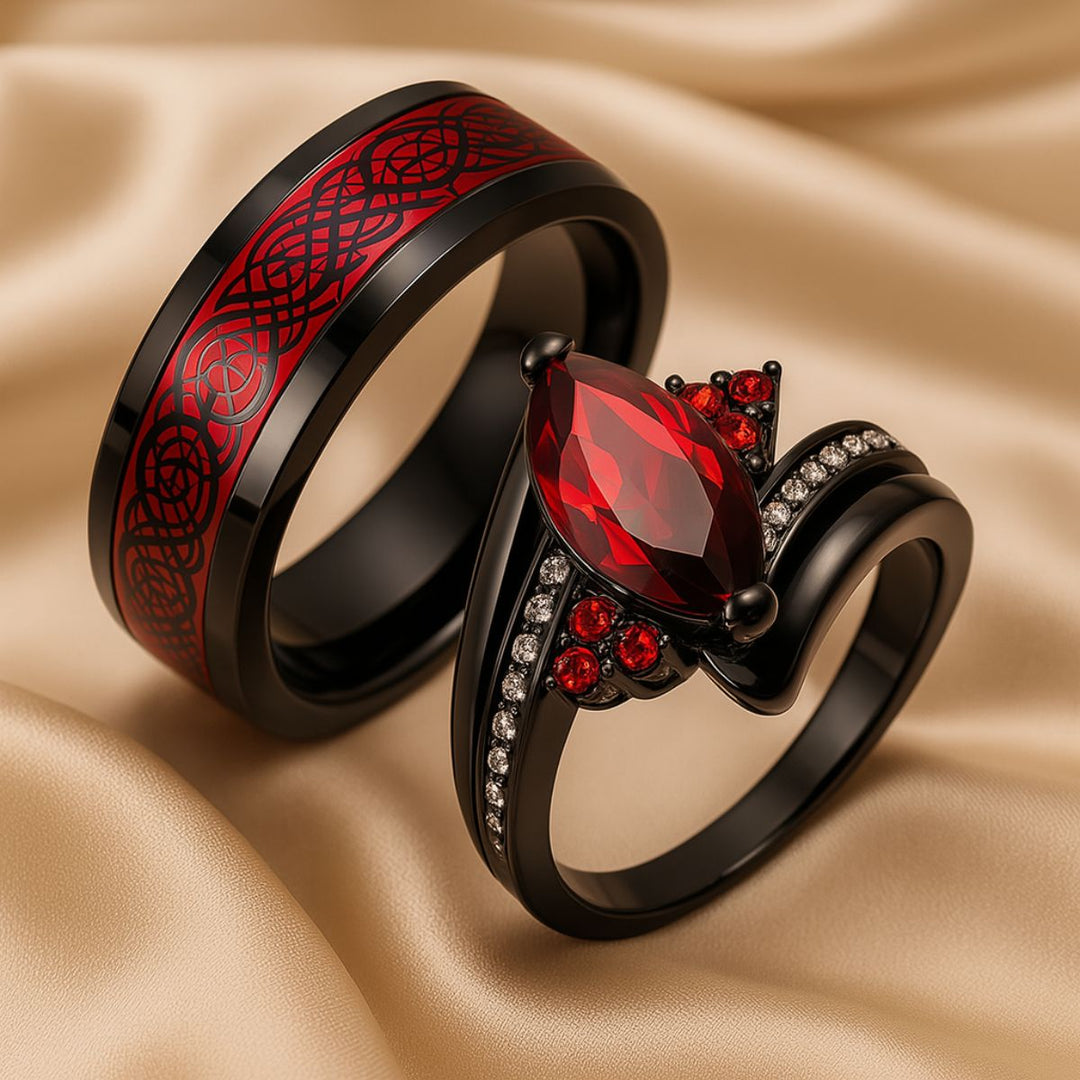 Bold and elegant Red Velvet ring set from CouplesChoices.com, crafted in black titanium with a marquise-cut red center stone, pavé accents, and a red Celtic infinity inlay symbolizing eternal passion.