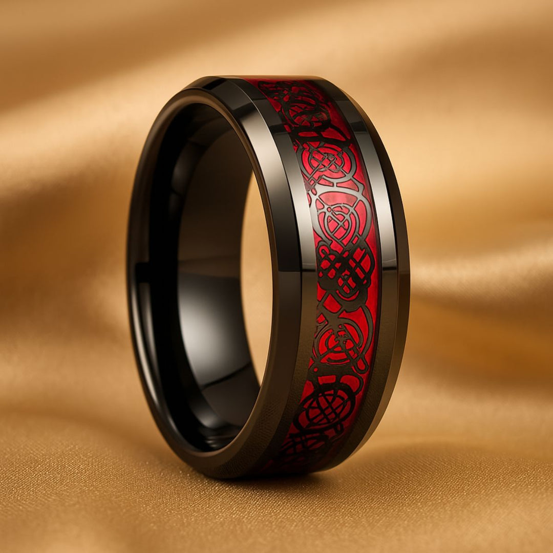 Bold and elegant Red Velvet ring set from CouplesChoices.com, crafted in black titanium with a marquise-cut red center stone, pavé accents, and a red Celtic infinity inlay symbolizing eternal passion.