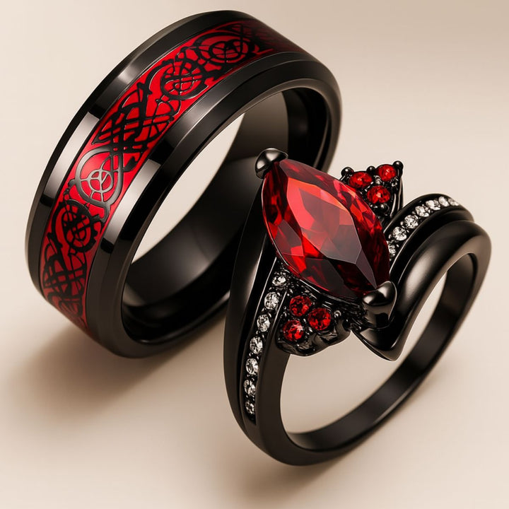Bold and elegant Red Velvet ring set from CouplesChoices.com, crafted in black titanium with a marquise-cut red center stone, pavé accents, and a red Celtic infinity inlay symbolizing eternal passion.