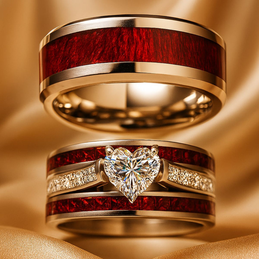Bold and romantic, the Love Passion Rings by CouplesChoices.com feature a heart-shaped diamond centerpiece, flanked by radiant red inlays and shimmering pavé-set stones, symbolizing eternal devotion in striking style.