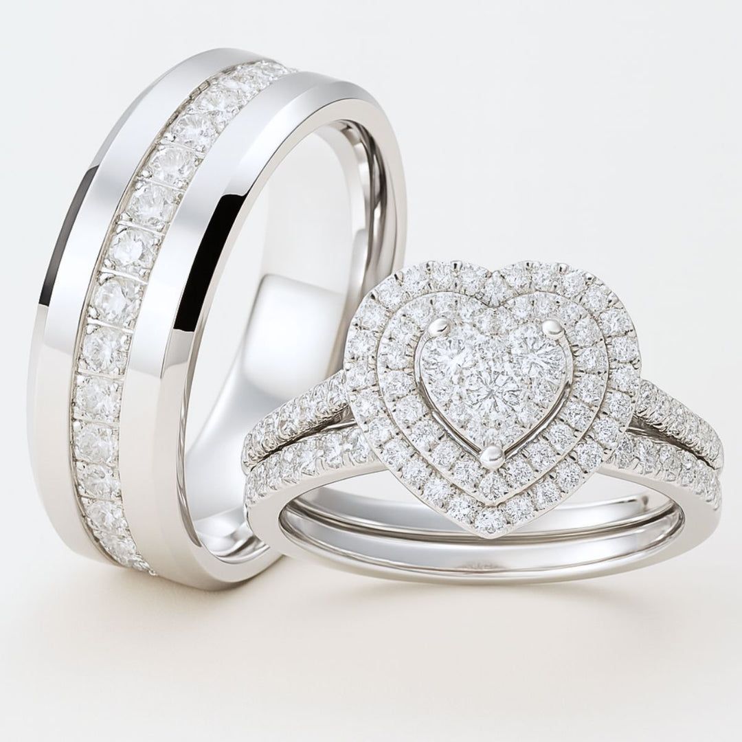 CouplesChoices.com Infinity Rings – A dazzling bridal set with a heart-shaped diamond cluster and pavé halos, paired with a men’s polished band inlaid with channel-set diamonds. A timeless expression of infinite love and luxury.