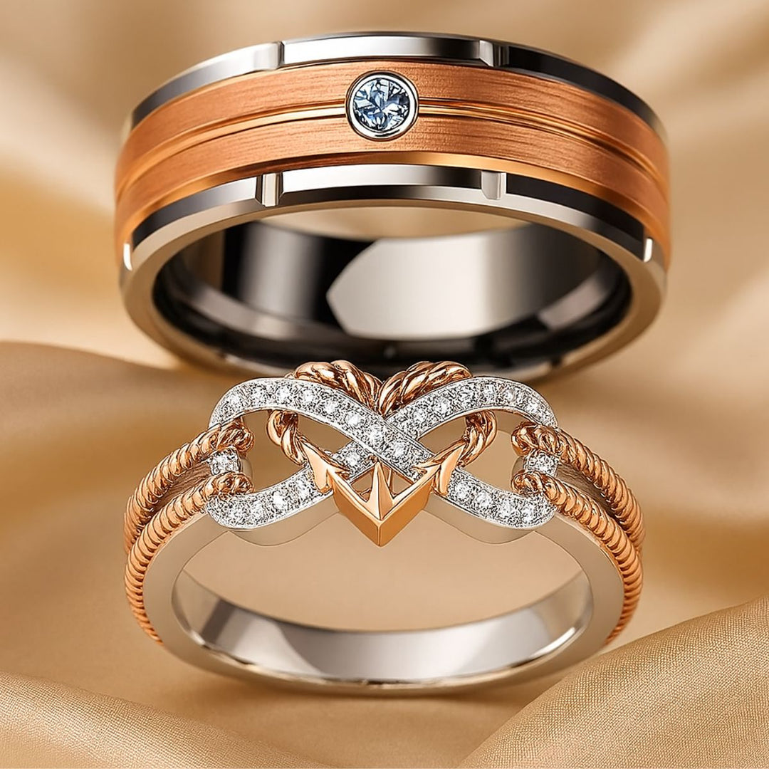 CouplesChoices.com Love Again Rings – Matching set with a men’s brushed rose gold and tungsten band featuring a bezel-set diamond, and a women’s infinity-heart ring in rose gold and pavé diamonds. Elegant symbols of timeless love.