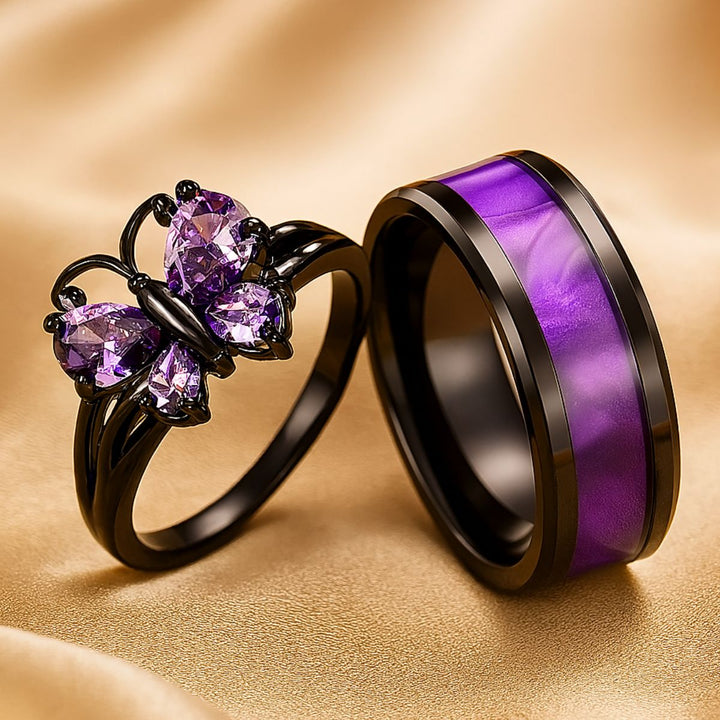 CouplesChoices.com Purple Wings Rings – A striking black-plated set featuring a butterfly-shaped amethyst ring and a matching band with shimmering violet inlay. Bold, romantic, and beautifully symbolic of transformation and eternal love.