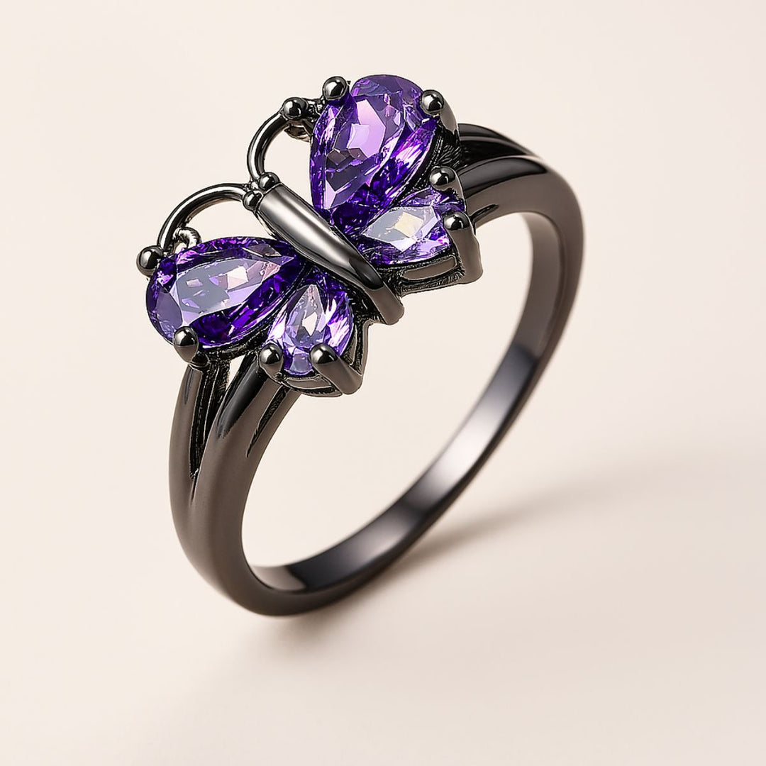 CouplesChoices.com Purple Wings Rings – A striking black-plated set featuring a butterfly-shaped amethyst ring and a matching band with shimmering violet inlay. Bold, romantic, and beautifully symbolic of transformation and eternal love.