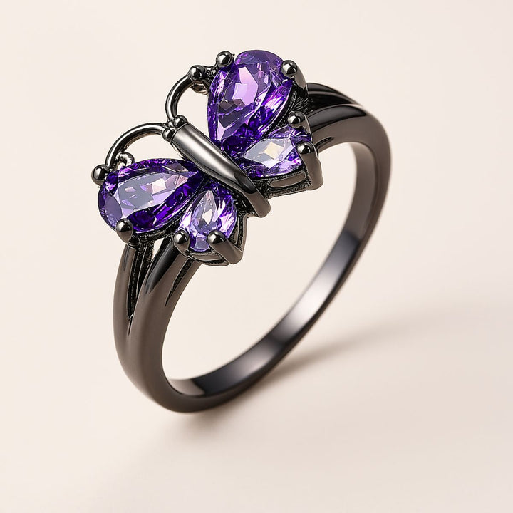 CouplesChoices.com Purple Wings Rings – A striking black-plated set featuring a butterfly-shaped amethyst ring and a matching band with shimmering violet inlay. Bold, romantic, and beautifully symbolic of transformation and eternal love.
