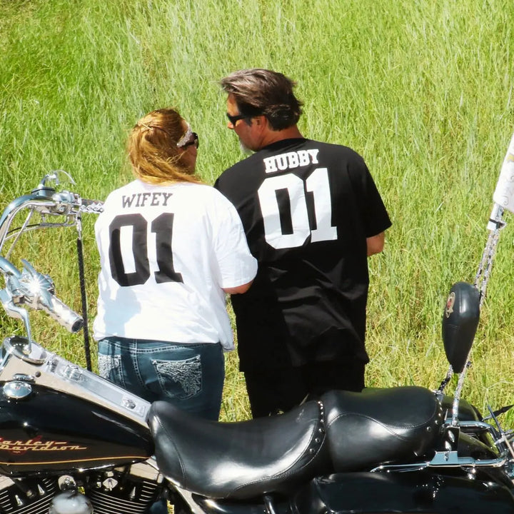 CouplesChoices.com matching ‘Wifey 01’ and ‘Hubby 01’ shirts – a bold, modern expression of love and unity, perfect for couples who ride together, adventure together, and lead as one.