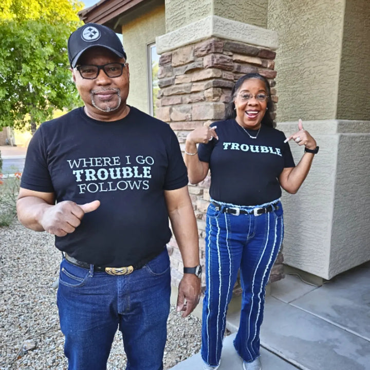 Couples black matching shirts from CouplesChoices.com—one reads “WHERE I GO TROUBLE FOLLOWS,” the other simply says “TROUBLE.” A cheeky, confident way to show playful love and unforgettable chemistry.