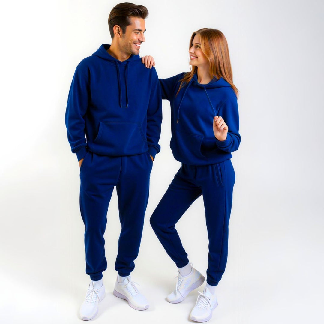 Couples dressed in vibrant royal blue matching tracksuits from CouplesChoices.com, combining bold color with modern loungewear design—crafted for statement comfort and elevated casualwear.