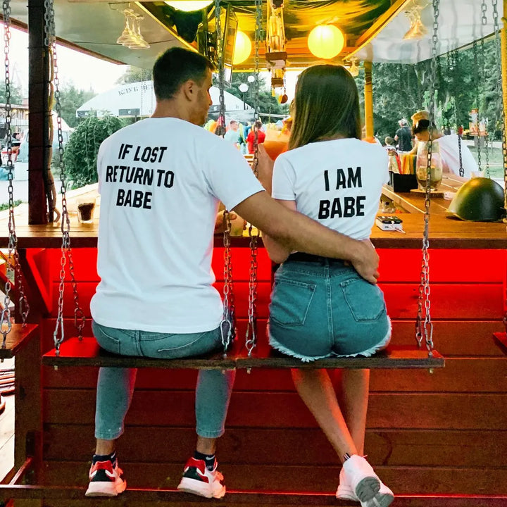 Couples matching white T-shirts from CouplesChoices.com—his says “If Lost Return to Babe,” hers says “I Am Babe.” A fun, romantic way to express loyalty, love, and playful devotion in a relationship.