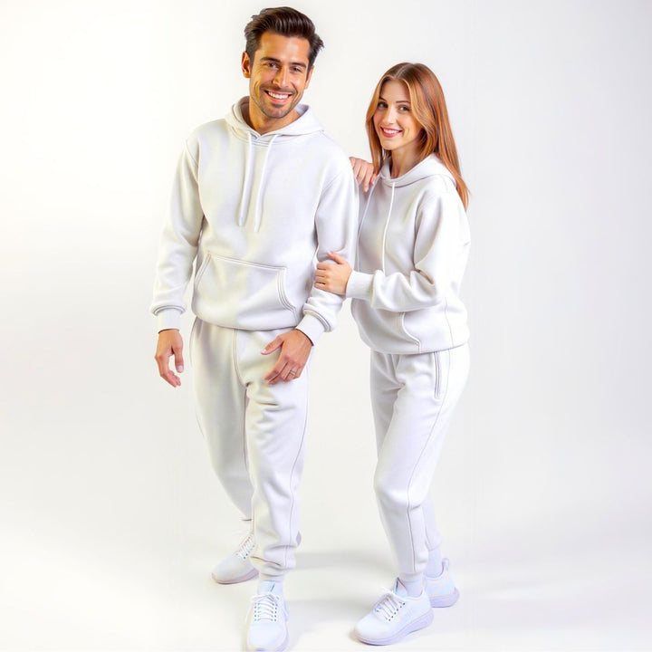 Couples styled in crisp white matching tracksuits from CouplesChoices.com, delivering a clean, minimalist aesthetic with premium comfort—designed for elevated everyday wear.