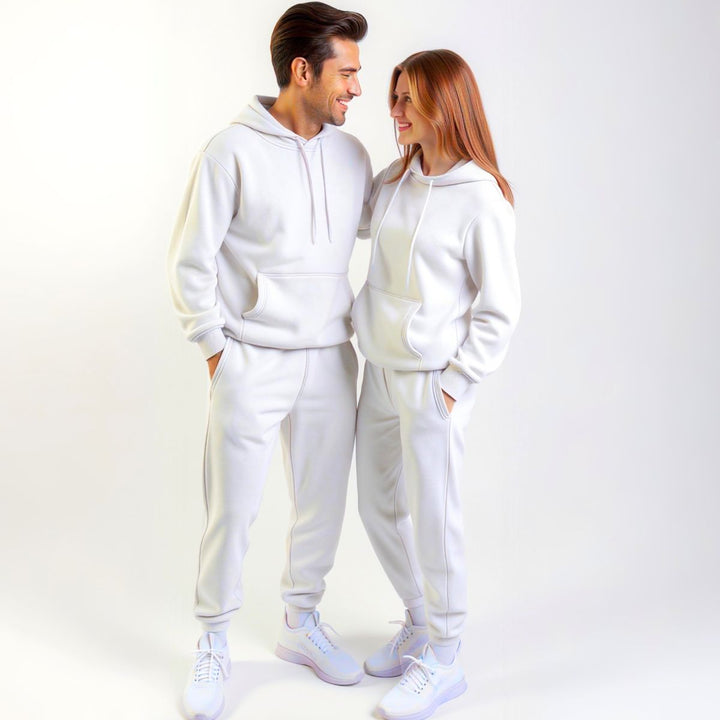 Couples styled in crisp white matching tracksuits from CouplesChoices.com, delivering a clean, minimalist aesthetic with premium comfort—designed for elevated everyday wear.