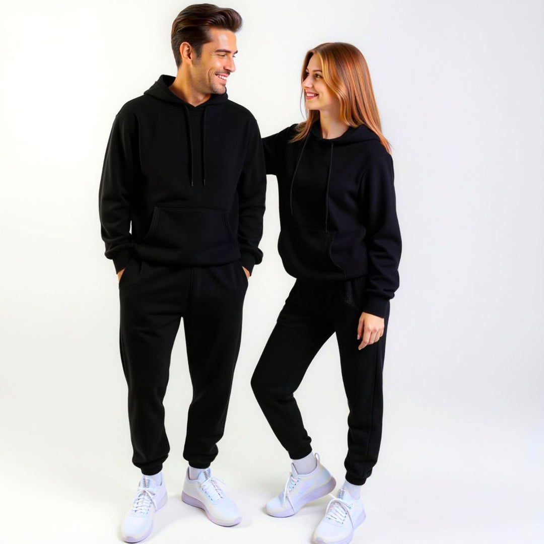 Couples styled in sleek black matching tracksuits from CouplesChoices.com, embodying elevated comfort and timeless streetwear appeal—perfect for bold, coordinated looks in any setting.