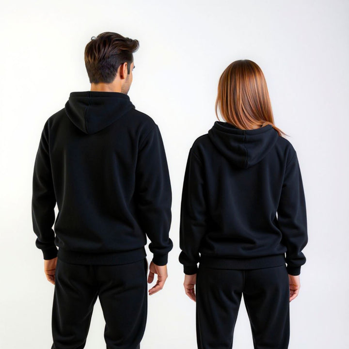 Couples styled in sleek black matching tracksuits from CouplesChoices.com, embodying elevated comfort and timeless streetwear appeal—perfect for bold, coordinated looks in any setting.