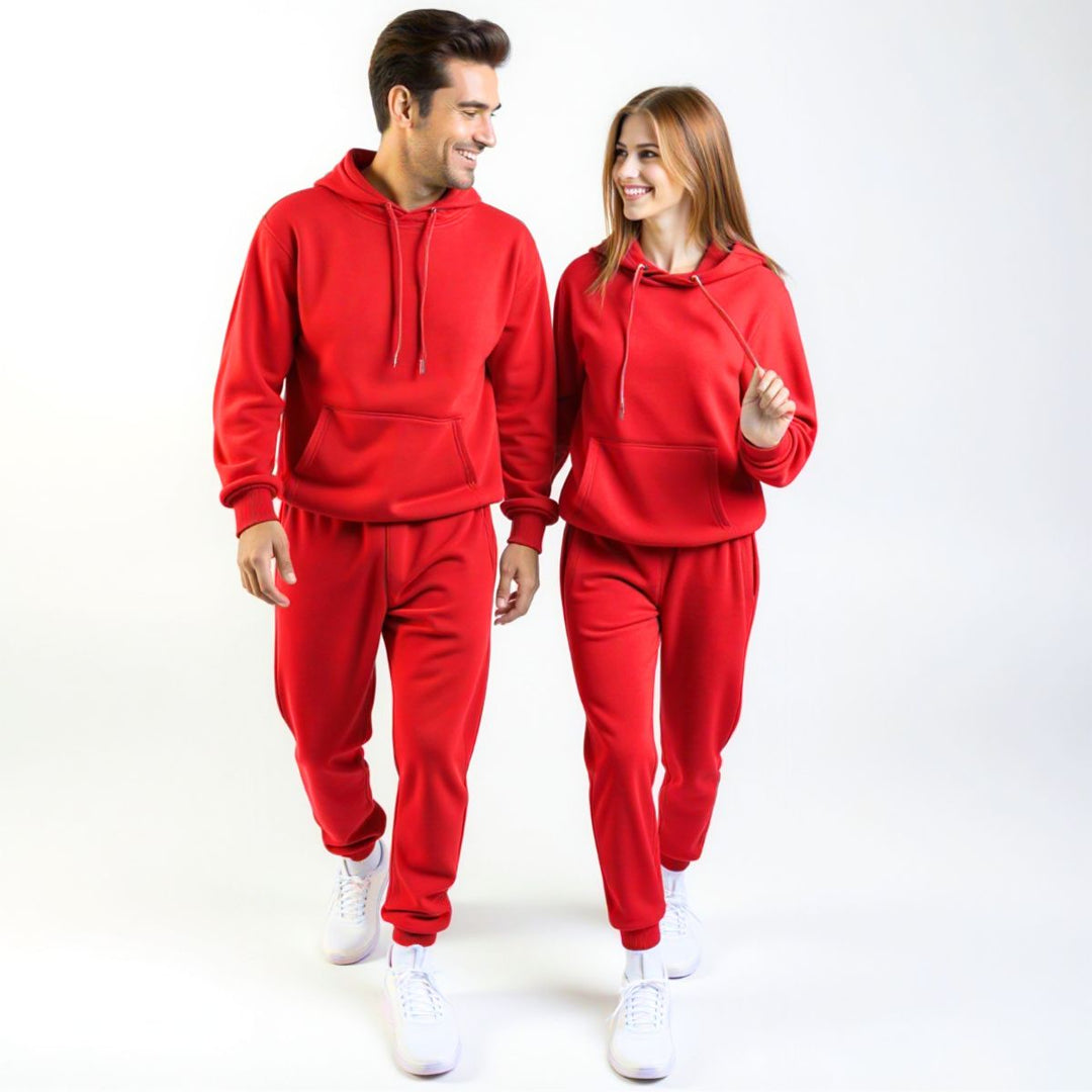 Couples wearing bold red matching tracksuits from CouplesChoices.com, merging high-impact color with elevated comfort—designed for standout coordination in everyday streetwear.