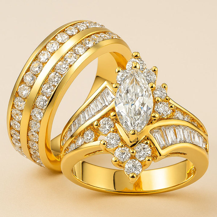 Curious Love Rings by CouplesChoices.com — a captivating gold wedding set featuring a marquise-cut centerpiece surrounded by round and baguette diamonds, crafted for bold, radiant elegance.