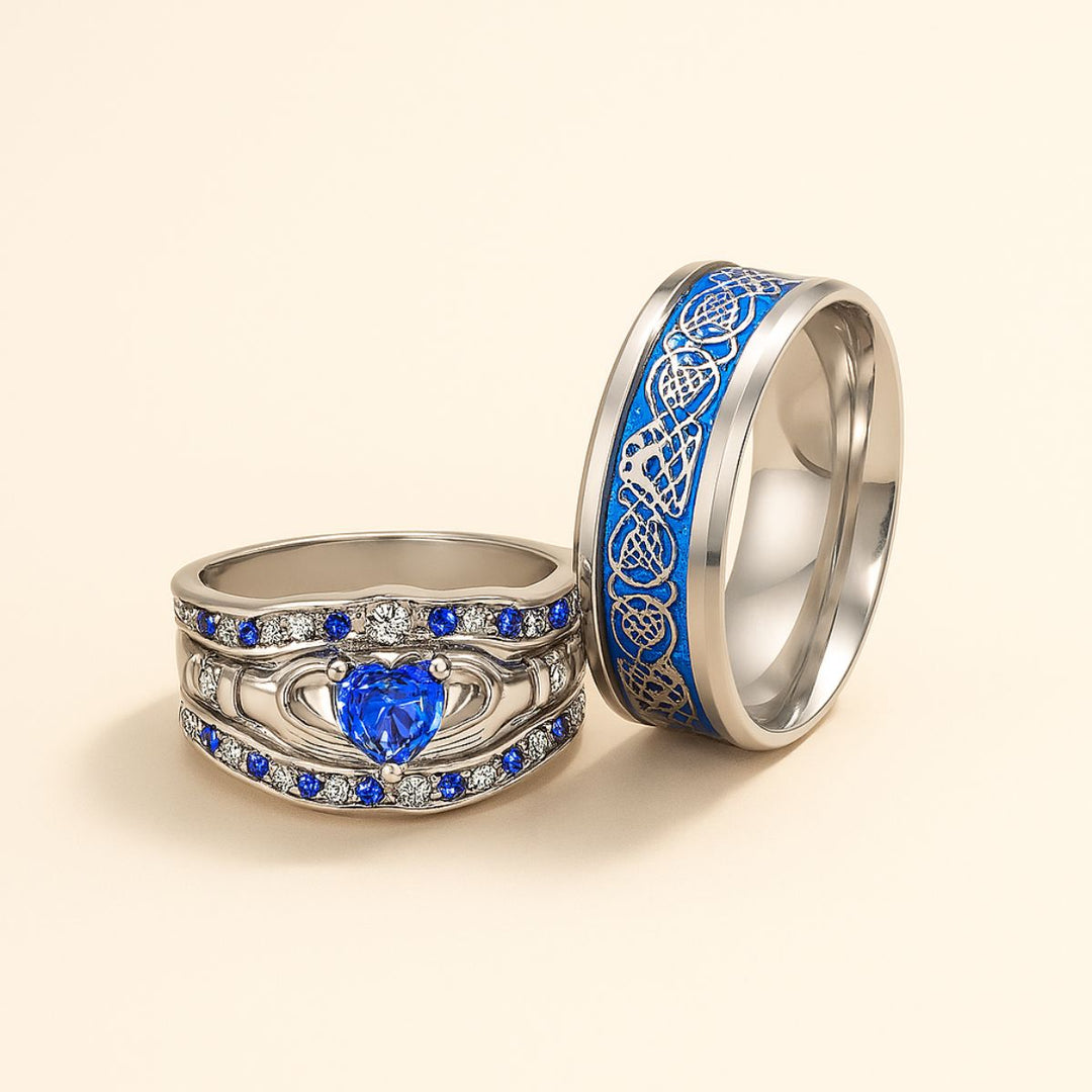 Deep Love Rings by CouplesChoices.com, featuring radiant sapphire-blue stones, Celtic-inspired details, and heart-shaped brilliance—crafted to celebrate powerful, lasting bonds with bold elegance.