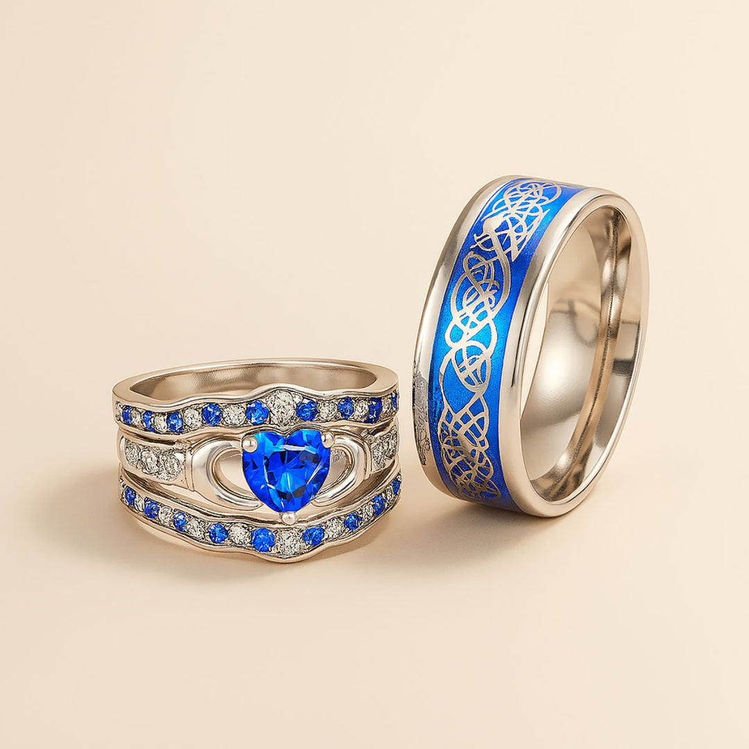 Deep Love Rings by CouplesChoices.com, featuring radiant sapphire-blue stones, Celtic-inspired details, and heart-shaped brilliance—crafted to celebrate powerful, lasting bonds with bold elegance.