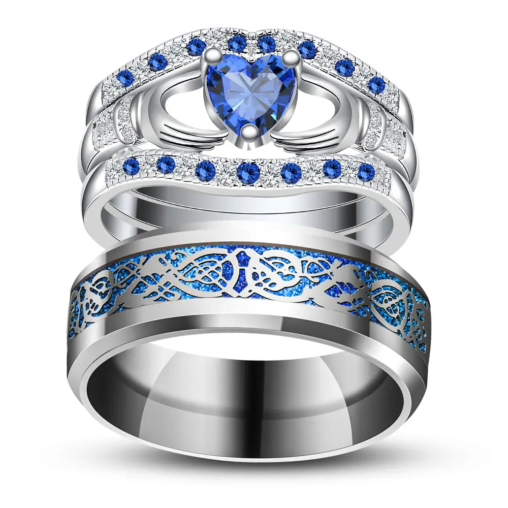 Deep Love Rings by CouplesChoices.com, featuring radiant sapphire-blue stones, Celtic-inspired details, and heart-shaped brilliance—crafted to celebrate powerful, lasting bonds with bold elegance.