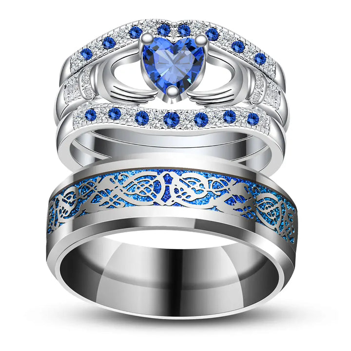Deep Love Rings by CouplesChoices.com, featuring radiant sapphire-blue stones, Celtic-inspired details, and heart-shaped brilliance—crafted to celebrate powerful, lasting bonds with bold elegance.