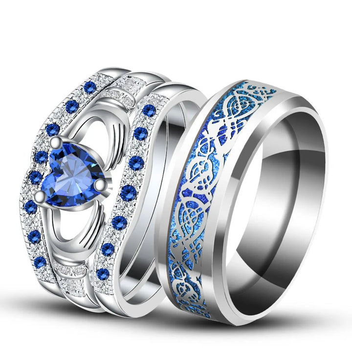 Deep Love Rings by CouplesChoices.com, featuring radiant sapphire-blue stones, Celtic-inspired details, and heart-shaped brilliance—crafted to celebrate powerful, lasting bonds with bold elegance.