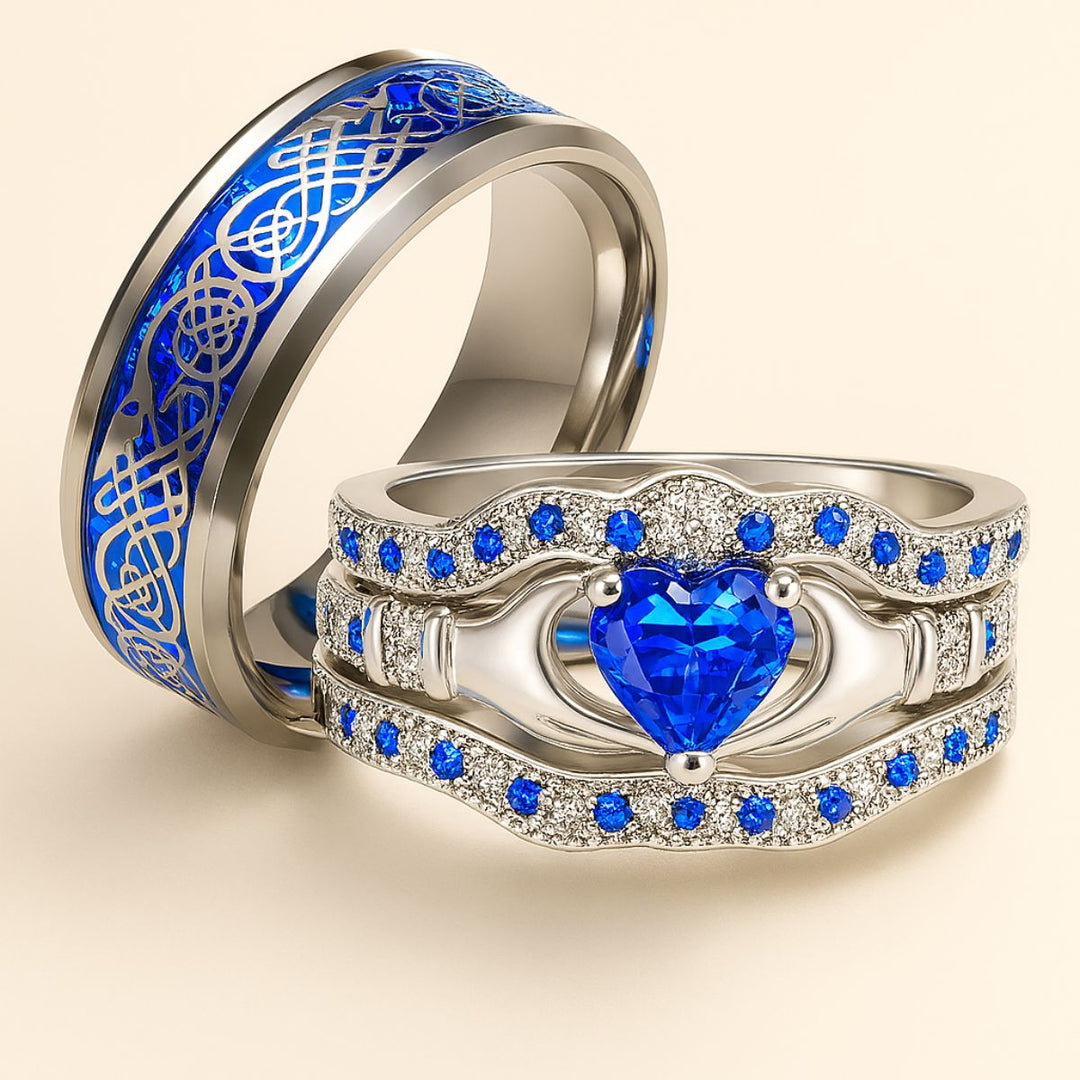 Deep Love Rings by CouplesChoices.com, featuring radiant sapphire-blue stones, Celtic-inspired details, and heart-shaped brilliance—crafted to celebrate powerful, lasting bonds with bold elegance.