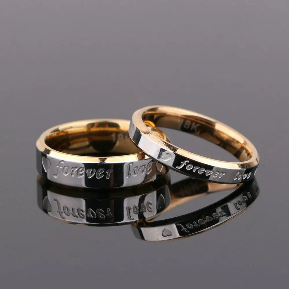 Elegant Forever Love Rings by CouplesChoices.com in radiant gold and silver tones, engraved with hearts and timeless words—crafted to symbolize eternal commitment and cherished connection.