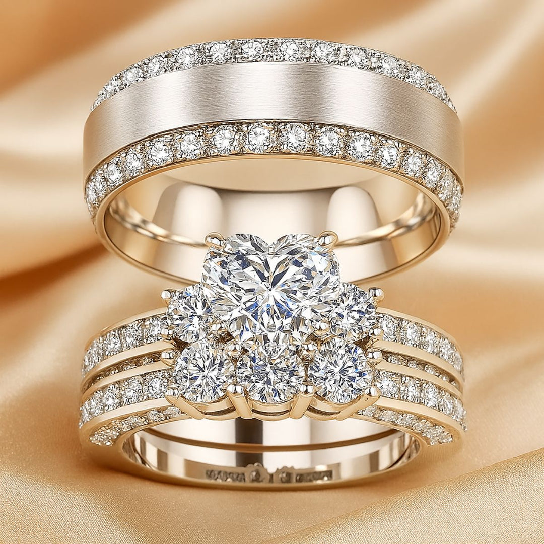 Elegant Hearted Love Rings by CouplesChoices.com, featuring a heart-shaped diamond centerpiece, triple-band pavé setting, and a matching diamond eternity men's band – luxury crafted for timeless commitment and bold style.