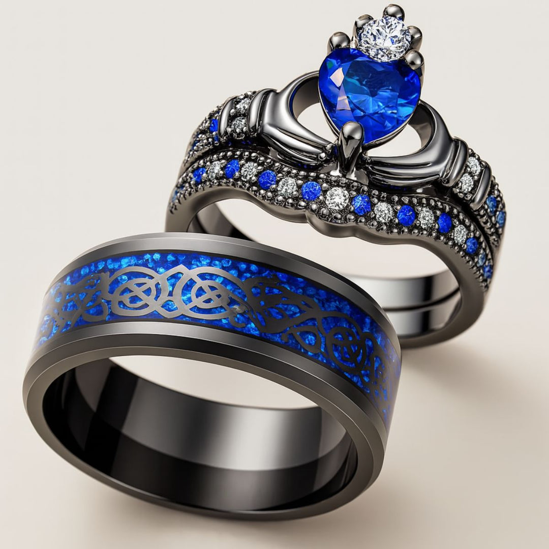 Elegant black titanium Unending Love ring set by CouplesChoices.com, featuring a sapphire heart, pavé-set stones, and a Celtic infinity pattern symbolizing eternal love.