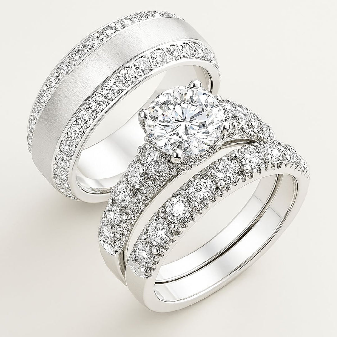 Elegant sterling silver bridal set with flawless pavé-set diamonds and a brilliant round solitaire centerpiece. Timeless in design and luminous in craftsmanship—Ever Rings by CouplesChoices.com defines forever.