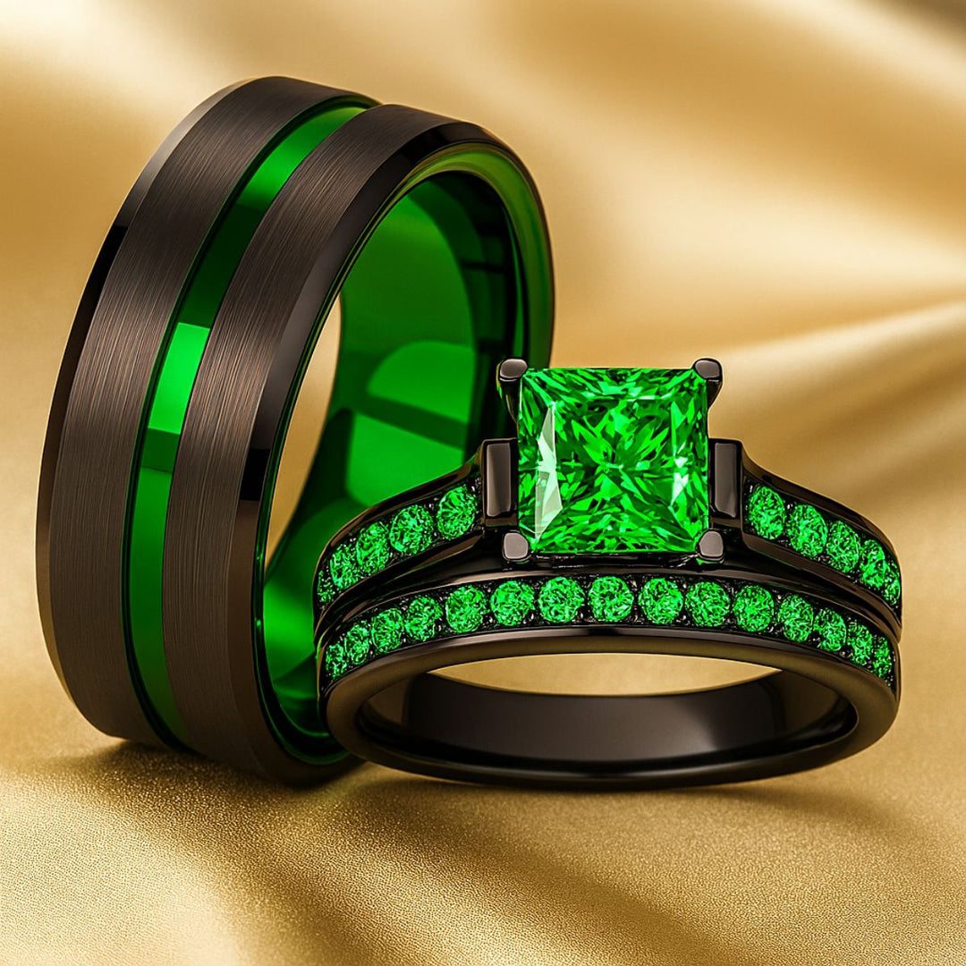 Emerald Breath Ring Set by CouplesChoices.com featuring a princess-cut green center stone on a black pavé band, paired with a brushed black men’s ring accented by a vivid emerald-green inlay.