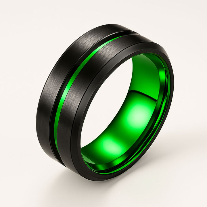 Emerald Breath Ring Set by CouplesChoices.com featuring a princess-cut green center stone on a black pavé band, paired with a brushed black men’s ring accented by a vivid emerald-green inlay.