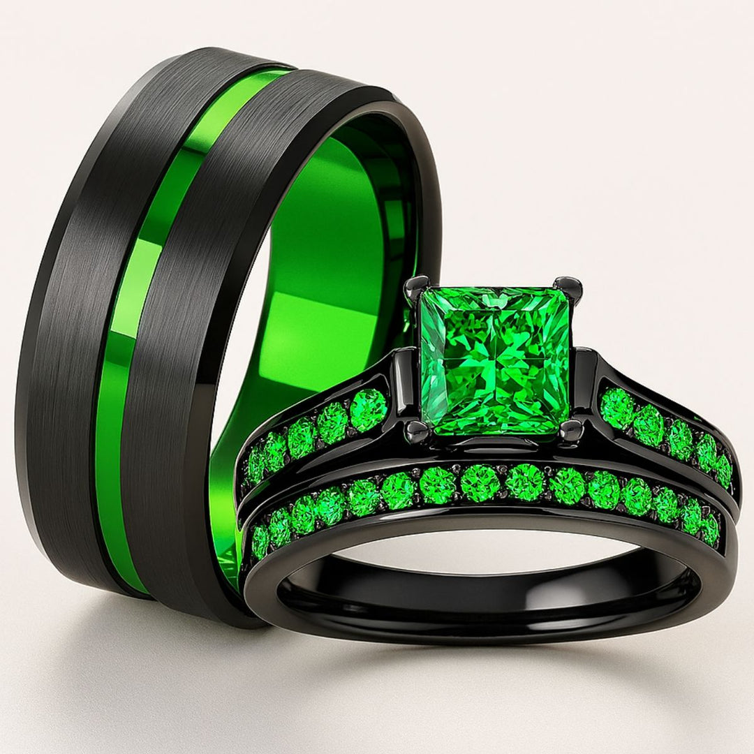 Emerald Breath Ring Set by CouplesChoices.com featuring a princess-cut green center stone on a black pavé band, paired with a brushed black men’s ring accented by a vivid emerald-green inlay.