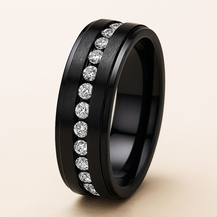 Euphoria Ring Set by CouplesChoices.com featuring a round-cut center stone on a black pavé halo setting, paired with a coordinating diamond-lined wedding band and a bold men’s ring with a full pavé channel.