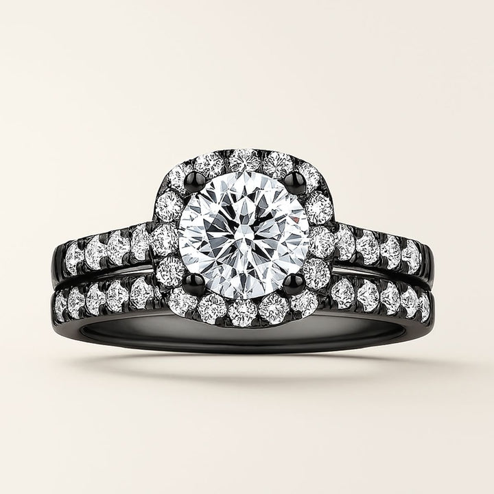 Euphoria Ring Set by CouplesChoices.com featuring a round-cut center stone on a black pavé halo setting, paired with a coordinating diamond-lined wedding band and a bold men’s ring with a full pavé channel.