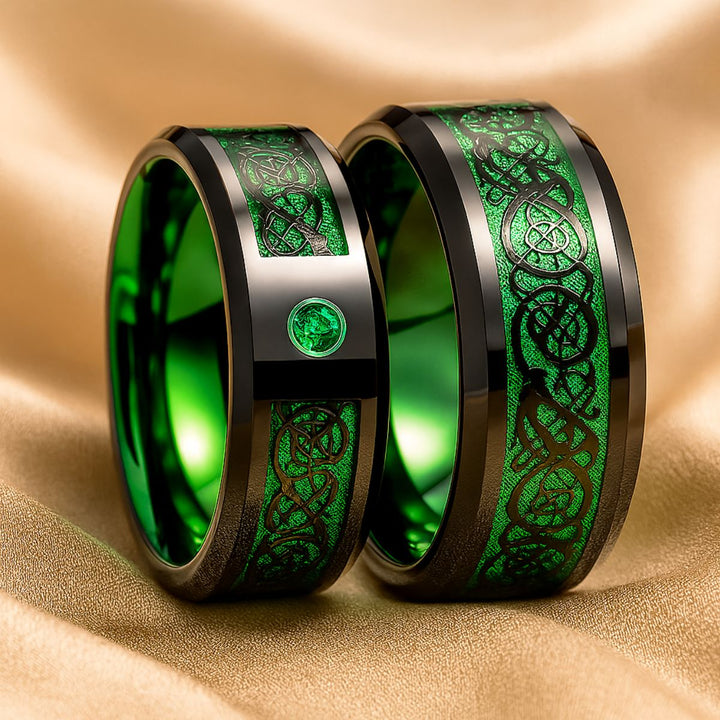 Green Grass Rings by CouplesChoices.com—bold black bands with radiant emerald inlays and Celtic-inspired patterns, symbolizing growth, loyalty, and eternal love in nature’s most vibrant hue.