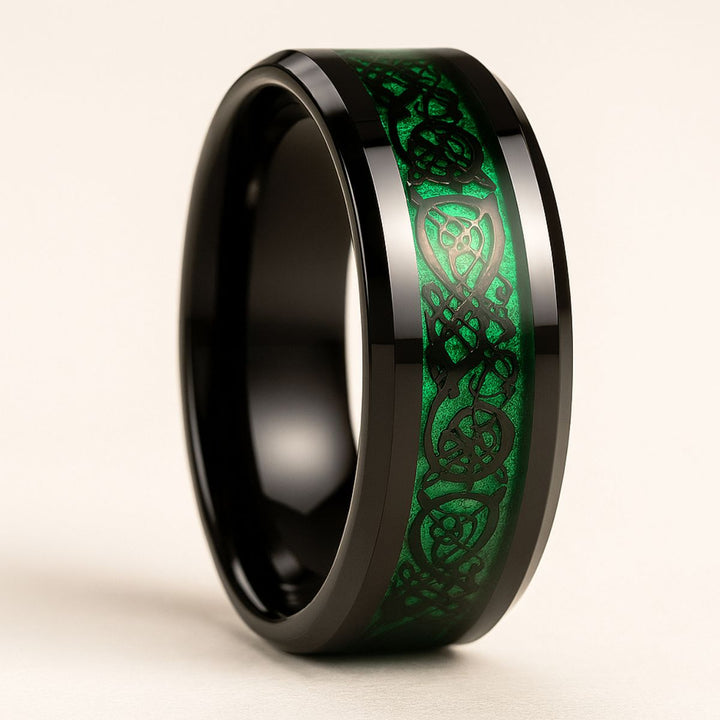 Green Grass Rings by CouplesChoices.com—bold black bands with radiant emerald inlays and Celtic-inspired patterns, symbolizing growth, loyalty, and eternal love in nature’s most vibrant hue.