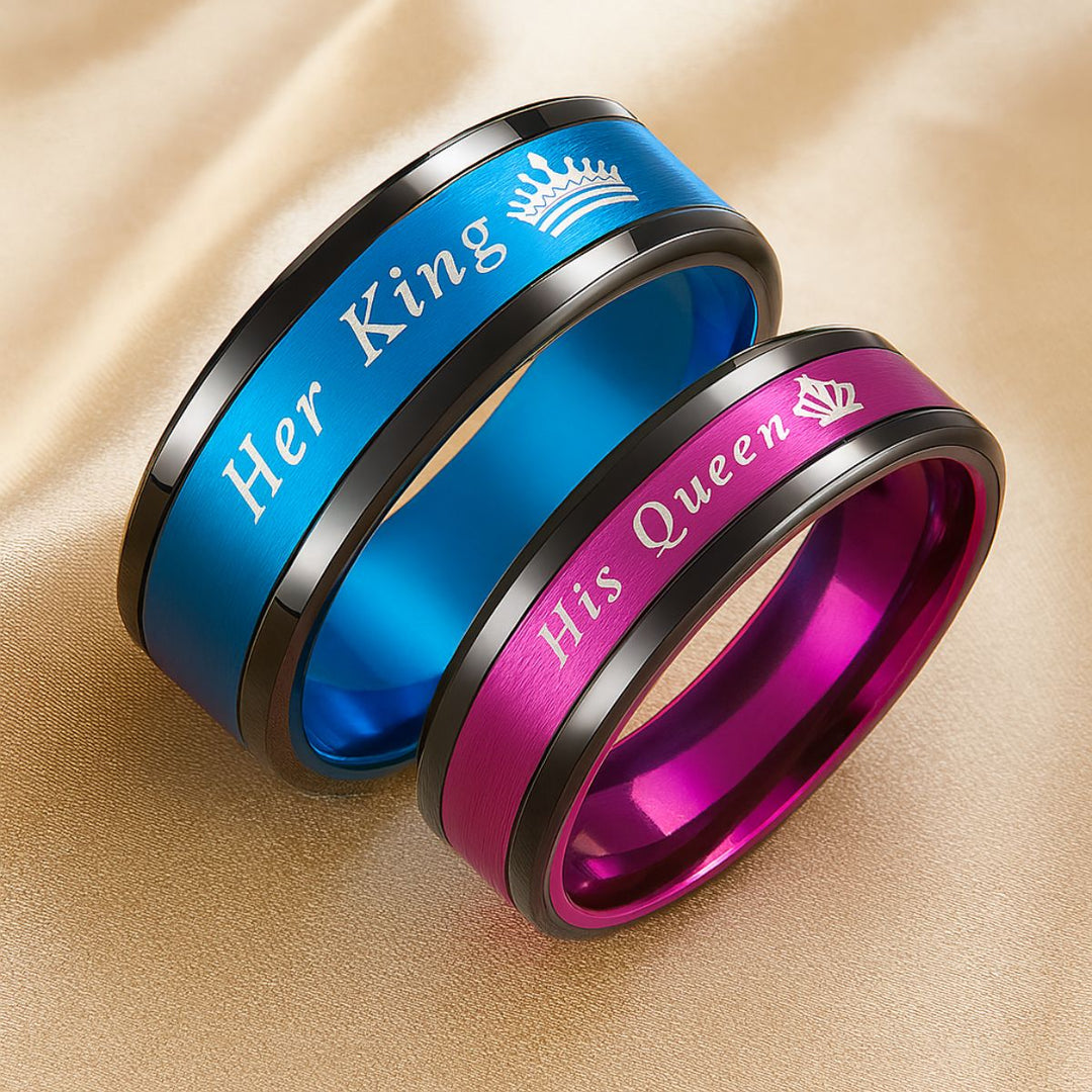 Love Blossom Rings by CouplesChoices.com—vivid titanium bands in electric blue and royal magenta, engraved with “Her King” and “His Queen.” A bold, vibrant tribute to passionate love and colorful devotion that knows no boundaries.