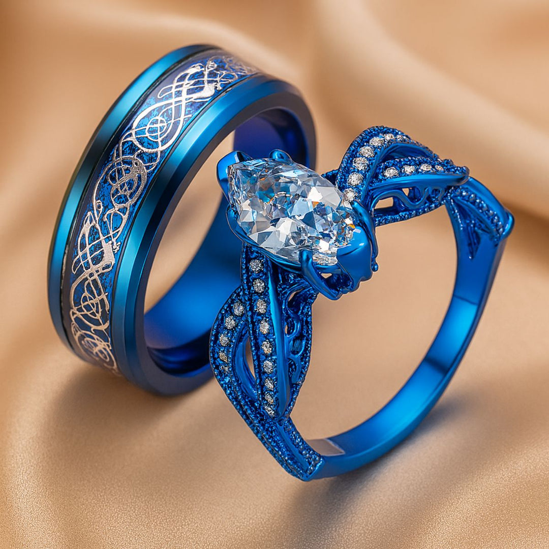 Love Lagoon rings by CouplesChoices.com—dazzling ocean-blue bands with intricate silver detailing and a marquise-cut crystal centerpiece. A breathtaking blend of artistry and romance, made for couples who love boldly and beautifully.