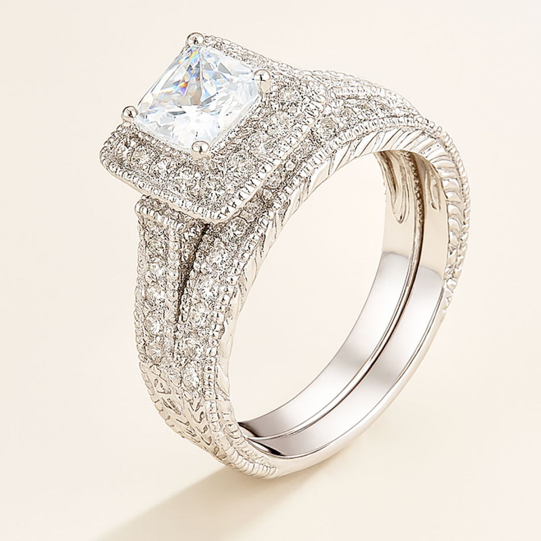Love Mountain Rings by CouplesChoices.com—an exquisite bridal set with a princess-cut centerpiece framed in pavé brilliance, paired with a bold, brushed band. Designed for enduring love that stands tall, timeless, and unshakable.