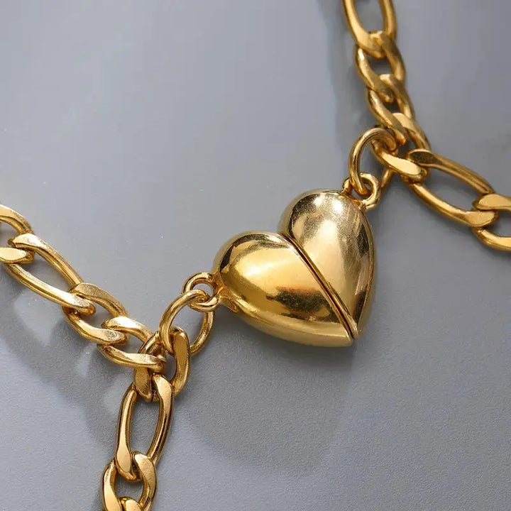 Magnet Love Bracelets by CouplesChoices.com—gold matching couple bracelets with heart-shaped magnetic charms that connect when together, symbolizing attraction and unity.