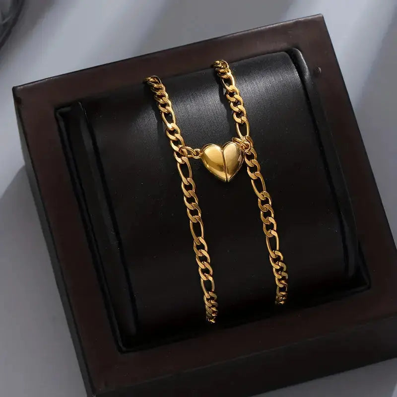 Magnet Love Bracelets by CouplesChoices.com—gold matching couple bracelets with heart-shaped magnetic charms that connect when together, symbolizing attraction and unity.